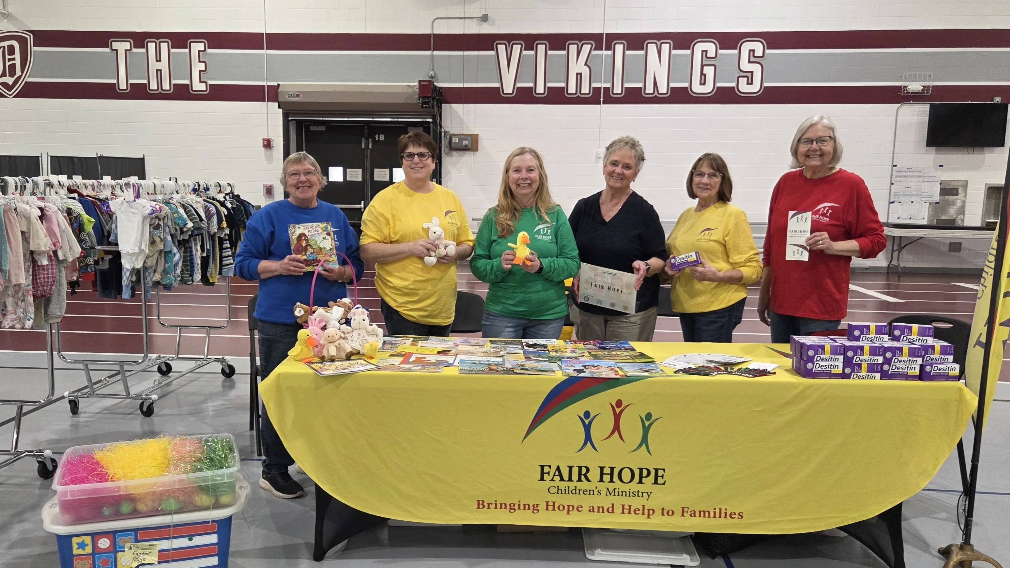 Fair Hope volunteers at their community booth